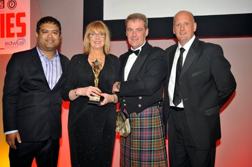 Jane and John of Excel Collect Their Vendie Award